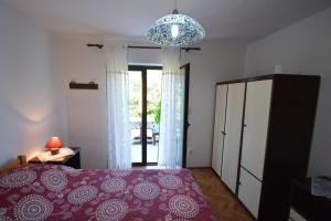 Postel nebo postele na pokoji v ubytování Apartments Nevenka