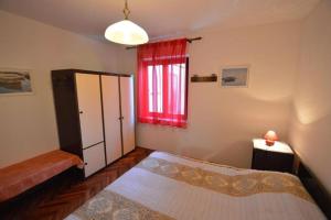 Postel nebo postele na pokoji v ubytování Apartments Nevenka