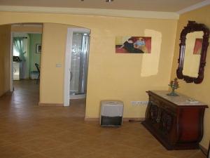 a living room with a mirror and a trash can at House - 2 Bedrooms with WiFi - 00117 in Bueu