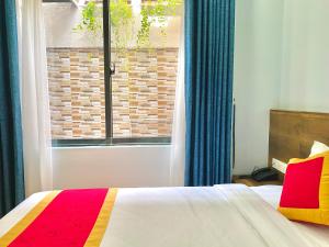 Postel nebo postele na pokoji v ubytování Golden Field Villa Hoi An