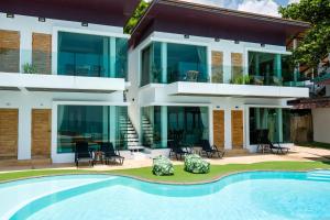 an image of a house with a swimming pool at 4U Resort Samui in Lamai