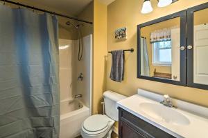 a bathroom with a sink and a toilet and a shower at Walk to Delavan Lake Extended Stay Home with Yard in Delavan +20 photos