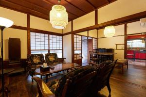 a large living room with chairs and a table at EK House Kamakura 鎌倉 Free Parking in Kamakura