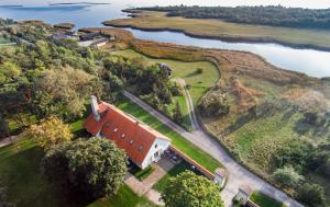 an aerial view of a house and a lake at Dagen Haus Guesthouse in Orjaku