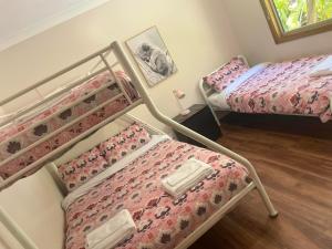 A bed or beds in a room at Chiltern Lodge Country Retreat