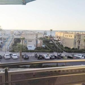 a view of a parking lot with cars parked at الاسكندريه المعموره الشاطئ in Alexandria