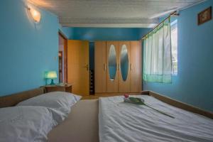 Postel nebo postele na pokoji v ubytování Apartments Tajci