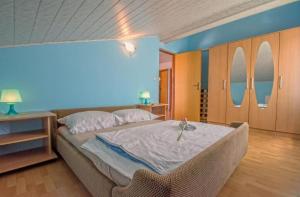 Postel nebo postele na pokoji v ubytování Apartments Tajci