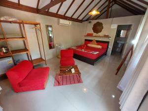 an overhead view of a living room with red furniture at Harley Moon Hideaway in Ko Chang