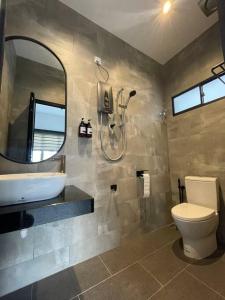 a bathroom with a sink and a toilet and a shower at 5000 SQFT BRAND NEW Semi-D Hype Home 10pax in Ipoh
