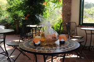 a table with two bottles and a basket on it at Casa Vacanze Marcella in Palinuro