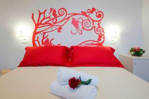 Postel nebo postele na pokoji v ubytování Hotel Maremma Sul Mare