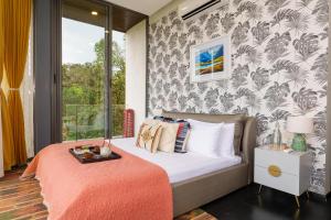 Ένα ή περισσότερα κρεβάτια σε δωμάτιο στο amã Stays & Trails - Villa Seven, Lonavala