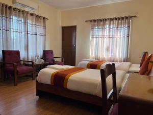 Una cama o camas en una habitación de Hotel Pokhara View
