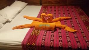 a group of stuffed animals on a bed at Komodo Liveaboard 3 Days 2 Night in Labuan Bajo