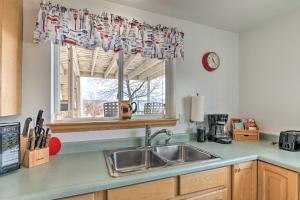 a kitchen with a sink and a window at Pet-Friendly Aurora House with Mountain Views! in Salina
