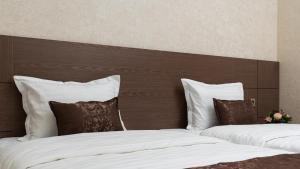 En eller flere senge i et værelse på ABIS Palace Hotel