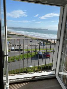 a view from a window of a parking lot at Southover Beach in Woolacombe