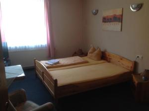
Ein Bett oder Betten in einem Zimmer der Unterkunft Gasthof Stadt Brandenburg
