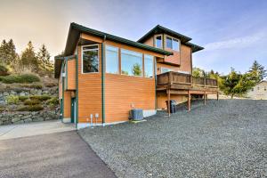 a house on a hill with a gravel driveway at Stunning Sequim Hideaway with Hot Tub and Views in Sequim