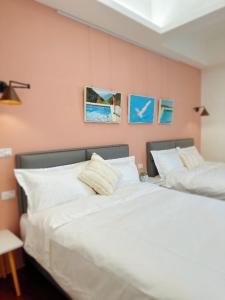 Postel nebo postele na pokoji v ubytování 游遊民宿 Yulazy inn 寵物友善 I 包棟