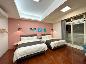 Postel nebo postele na pokoji v ubytování 游遊民宿 Yulazy inn 寵物友善 I 包棟