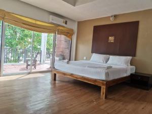 Postel nebo postele na pokoji v ubytování Siam Beach Resort