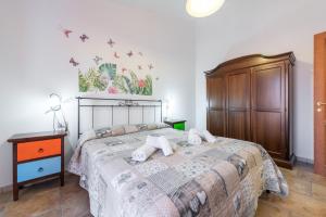 Voodi või voodid majutusasutuse Casa Vacanza L'agave B toas