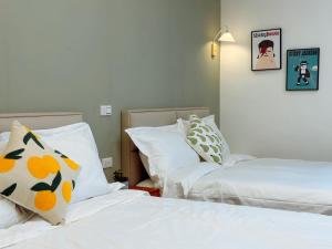 Postel nebo postele na pokoji v ubytování 游遊民宿 Yulazy inn 寵物友善 I 包棟