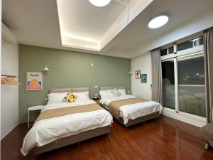 Postel nebo postele na pokoji v ubytování 游遊民宿 Yulazy inn 寵物友善 I 包棟