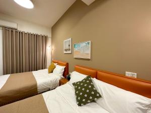 Postel nebo postele na pokoji v ubytování 游遊民宿 Yulazy inn 寵物友善 I 包棟
