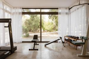 a room with a gym with a large window at Villa Pueblo in Nafplio