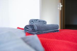 a pair of towels sitting on top of a bed at FullHouse - Eisenach - K31 - Balcony - 2 Queensize Beds - SmartTV in Eisenach +29 photos