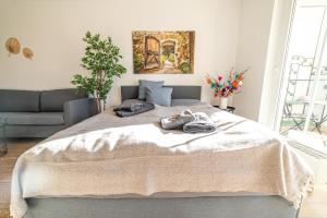 a bedroom with a large bed with towels on it at FullHouse - Eisenach - K31 - Balcony - 2 Queensize Beds - SmartTV in Eisenach