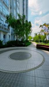 a circle in the middle of a sidewalk in a city at The Asando Above Pakuwon Mall in Lontar +47 photos