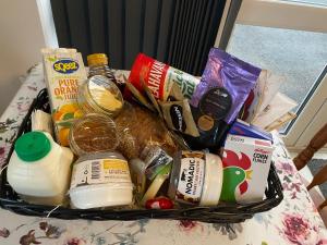 a basket filled with food on a table at Robin's Nest in Donegal