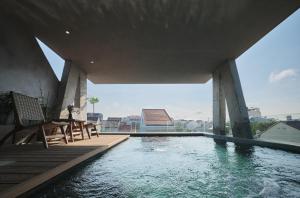 a swimming pool on the roof of a house at Barbados Cherry Villa in Hoi An