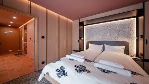 Posteľ alebo postele v izbe v ubytovaní Apartamenty Sun & Snow Resorts F Białka Tatrzańska z sauną