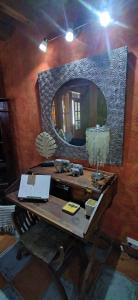 a dressing table with a mirror on a wall at El Balconcillo-Los Sitios de Aravalle in Umbrías