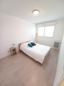 Posteľ alebo postele v izbe v ubytovaní Apparteo Perpignan