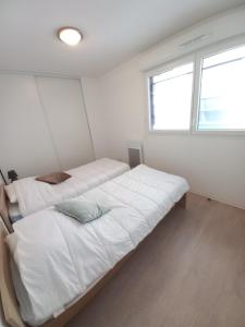 Posteľ alebo postele v izbe v ubytovaní Apparteo Perpignan