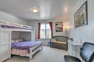 a bedroom with a bunk bed and a desk at Outdoorsy Utah Paradise with Mountain Views! in Salina