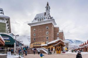 a large building with a steeple on a ski slope at Resort Plaza Condominiums 5002-5025 in Park City