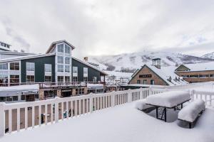a town covered in snow with a building at Resort Plaza Condominiums 5002-5025 in Park City
