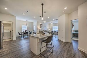 a kitchen and living room of a house at Newly Built Bella Vista Home Near Lakes in Bella Vista