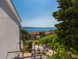 a balcony with a view of the water at Apartments Adrasteja in Dramalj