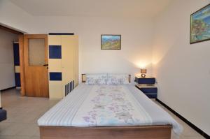 Postel nebo postele na pokoji v ubytování Apartments Ljiljana
