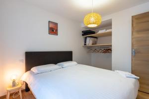 Posteľ alebo postele v izbe v ubytovaní Le 05-GregIMMO-Appart'Hôtel