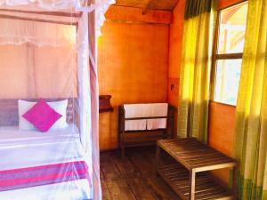 Letto o letti in una camera di Sungreen Cottage Sigiriya