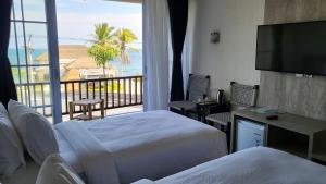 Postel nebo postele na pokoji v ubytování Adiwana Jelita Sejuba Natuna + 56 fotografií
